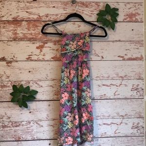 A sun dress with colorful flowers.